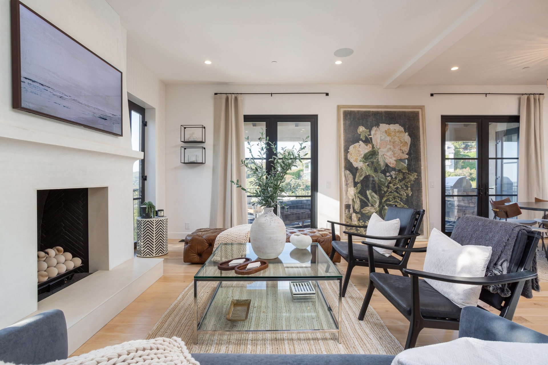 Living room with plaster fireplace and layered art