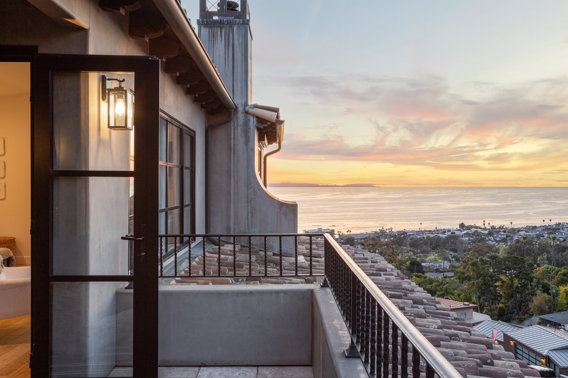Balcony at sunset overlooking the coast