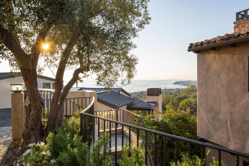Garden terrace with olive tree and ocean view